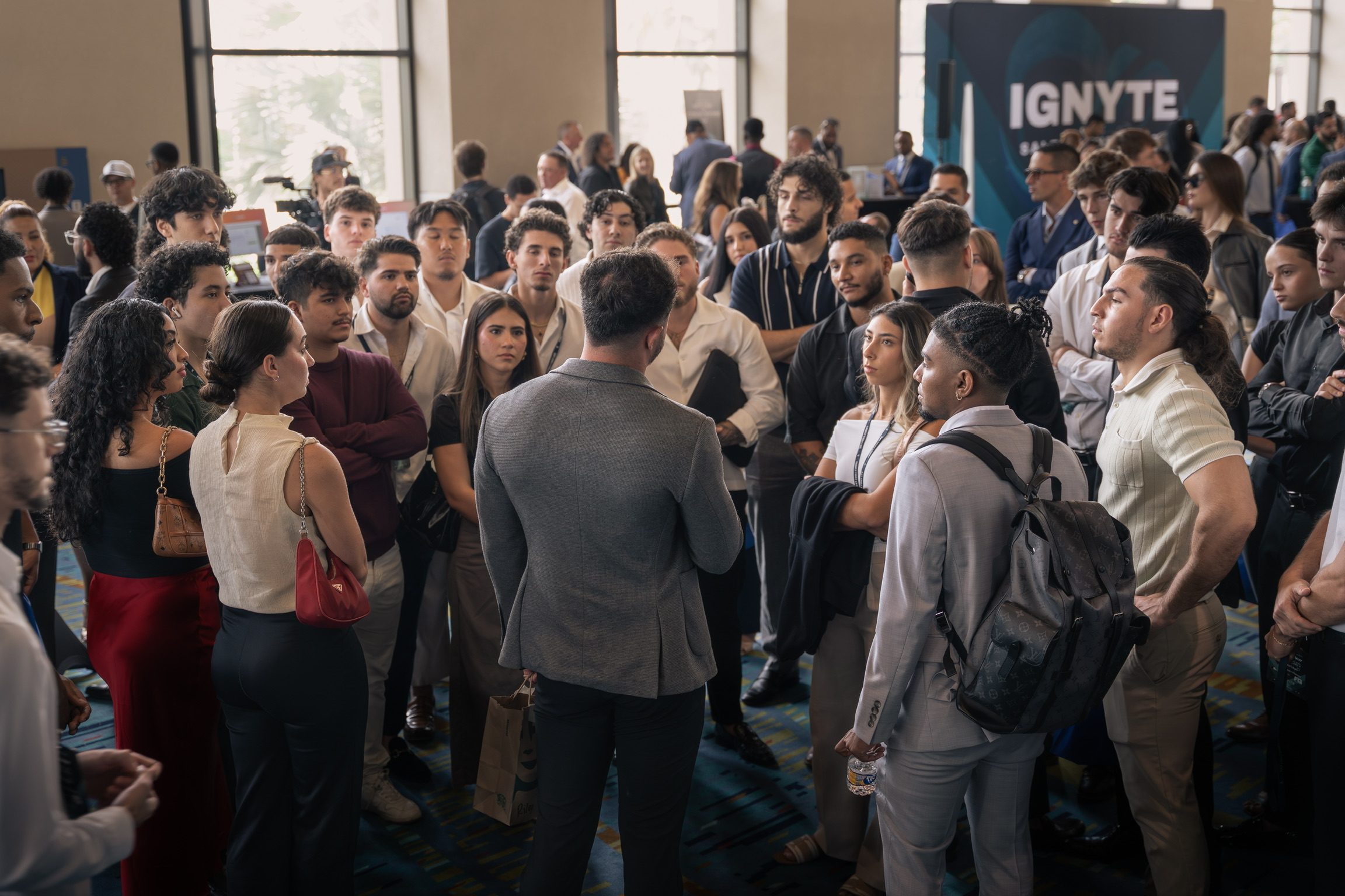 Jay Maska holding court with a crowd of operators at a live event